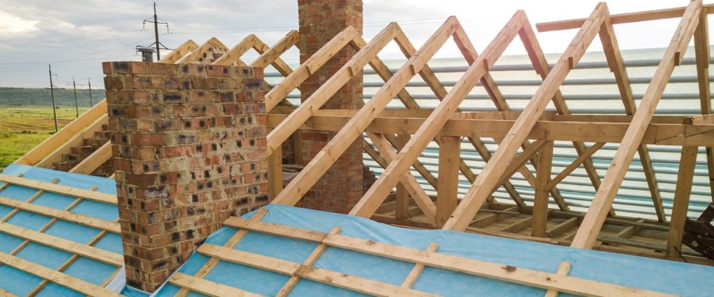 Roofing repair showing the exposed roof trusses